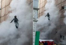 Man survives leap from eight-story building engulfed by fire