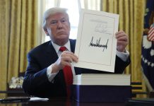 Trump signs $1.5 trillion tax overhaul into law