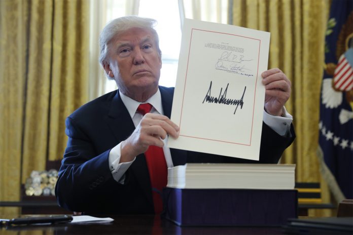 trump-signs-1-5-trillion-tax-overhaul-into-law.jpg