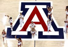 What got an Arizona cheerleader booted from rivalry game