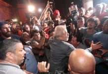 Brazil's Lula turns himself in to police after tense showdown