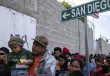 Dozens of migrants in caravan stuck at US-Mexico border