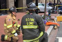 Bystanders pick up car to free trapped victims