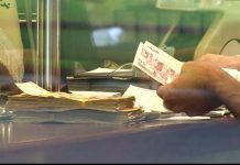 Iran currency halves in less than a year