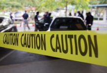 One dead after female employee opens fire at warehouse