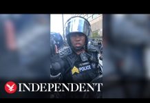 ‘I’d like to be out here helping you’: Atlanta police officer mediates with George Floyd protesters